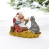 lille figur med julemand med risengrød og kat der skal smage af vilhelm hansen