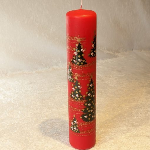 Rote Kalenderkerze, dekoriert mit Weihnachtsbäumen und Musiknoten
